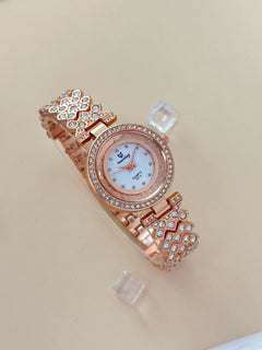 The Pave link watch rose tone